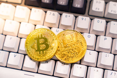 golden bitcoin on keyboard, Digital Currenyの写真素材