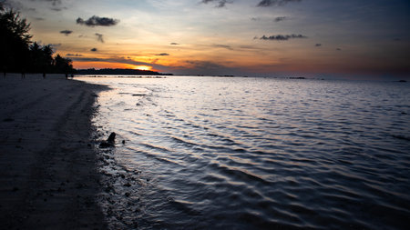 sunset on the beach in the tropics, beautiful photo digital pictureの写真素材