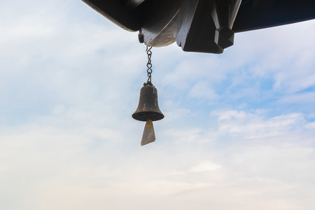 bell on a background of blue skyの写真素材