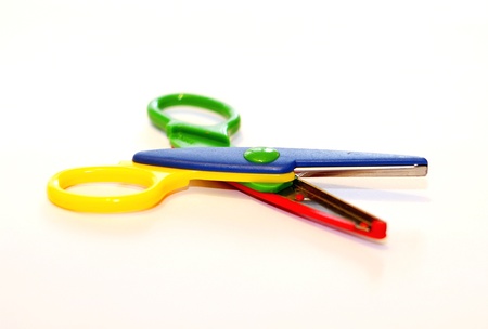 A colorful childrens scissors with white background.