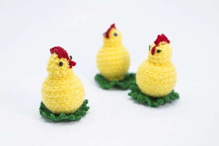 3 crochet chicks, made from yellow yarn.の写真素材