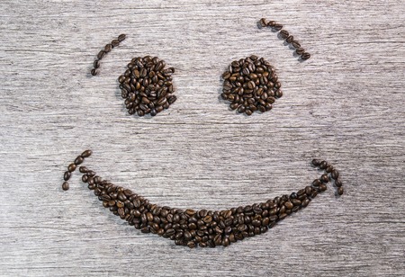 A smiley face from many coffee beansの写真素材