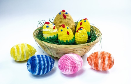 A brood of crochet chickens and some easter eggs.の写真素材
