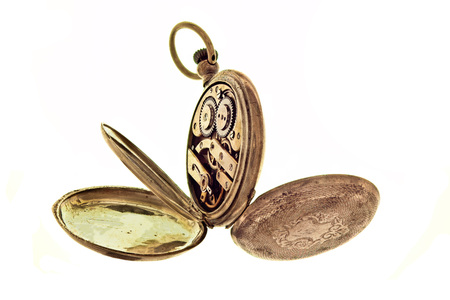 Vintage pocket watch isolated on a white background with  open three caps on inside.
