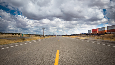 THOREAU, NM USA - May 11, 2013  Frontage Road  a k a  Old Route 66 , I-40, and train tracks のeditorial素材