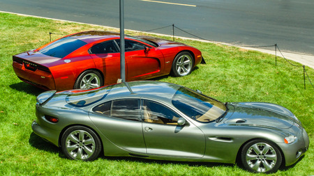 PLYMOUTH, MI USA - JULY 27, 2012  A 1999 Dodge Charger and a 1991 Chrysler 300 M concept cars on...