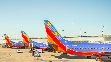 CHICAGO, ILUSA - April 11, 2015: Three Southwest airplanes parked at a Chicago Midway International Airport MDW terminal.のeditorial素材