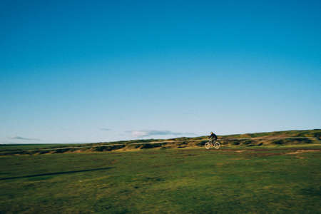 The blue sky and grasslandの写真素材