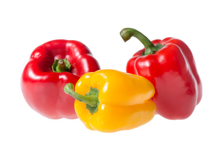 red and yellow peppers isolated on white backgroundの写真素材
