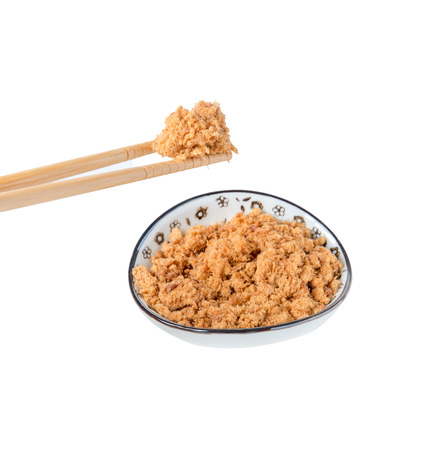 pork floss in the plate with chopsticks on white backgroundの写真素材