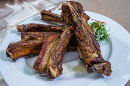Braised lamb shank in restaurantの写真素材