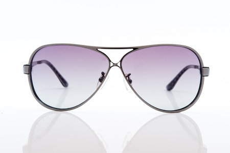 purple sunglasses on white backgroundの写真素材
