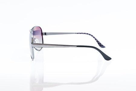 purple sunglasses on white backgroundの写真素材