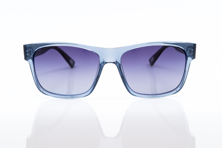 blue sunglasses on a white backgroundの写真素材