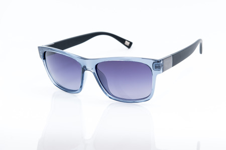 blue sunglasses on a white backgroundの写真素材