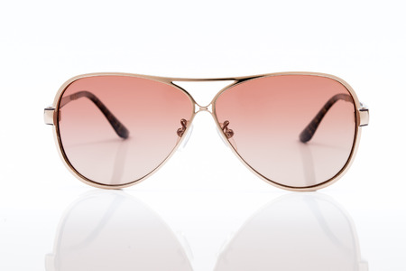 pink sunglasses on white backgroundの写真素材