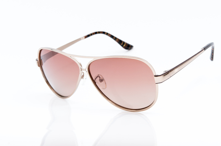 pink sunglasses on white backgroundの写真素材