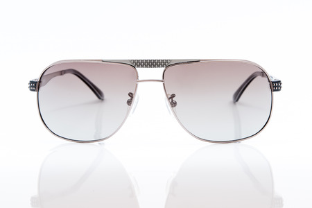 purple sunglasses on white backgroundの写真素材