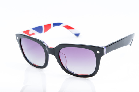 purple sunglasses with colorful picture frame isolated on white backgroundの写真素材