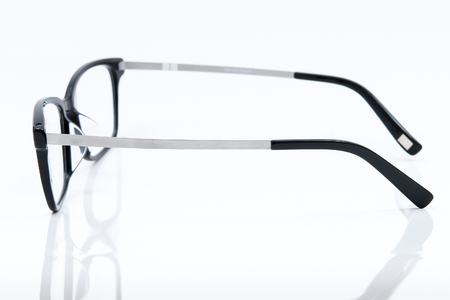 glasses with black frame on white backgroundの写真素材
