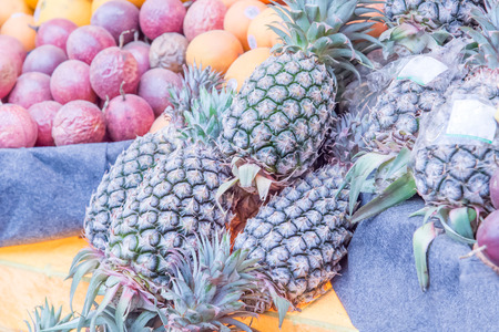fresh pineapple in a marketの写真素材