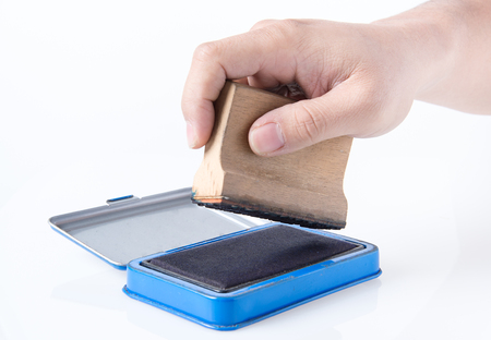 human hand holding seal and printing stamp padの写真素材