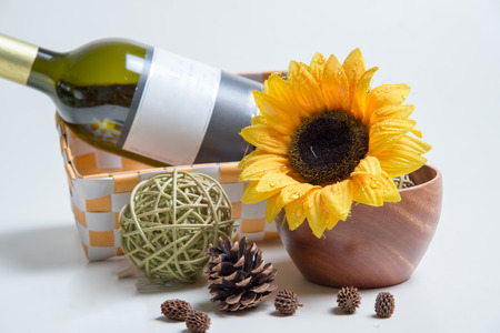 Sunflower, bottle and Pine conesの写真素材
