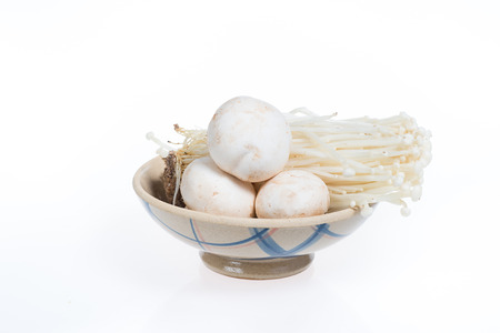 golden needle mushroom and matsutake mushroom in a bowl