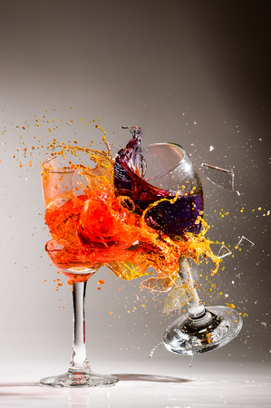 Water color splashing in glass wine on isolated backgroundの写真素材