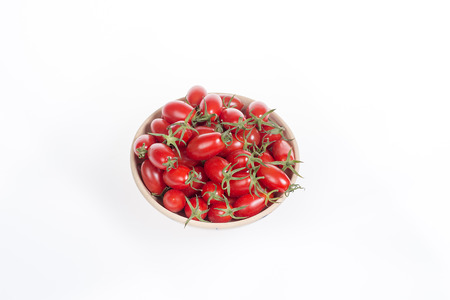 small tomatoes in a bowlの写真素材