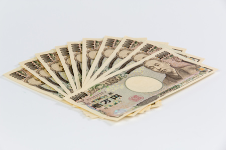 Japanese Yen banknotes on white backgroundの写真素材