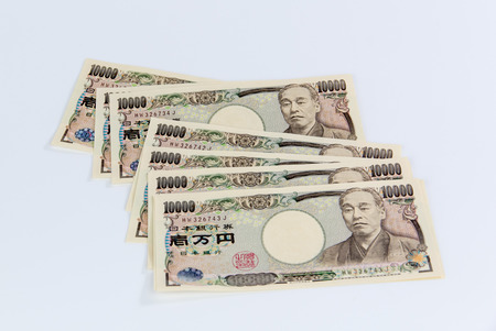 Japanese Yen banknotes on white backgroundの写真素材