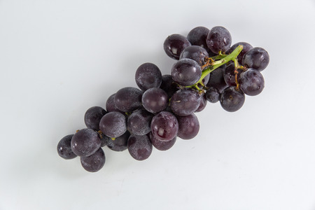 Grapes bunch isolated on white backgroundの写真素材