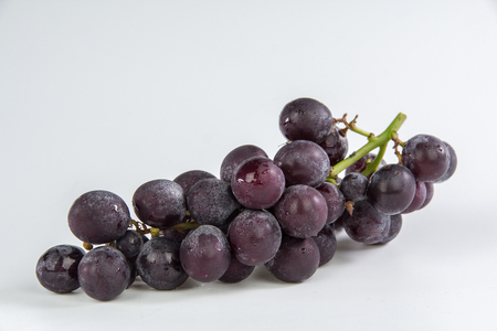 Grapes bunch isolated on white backgroundの写真素材