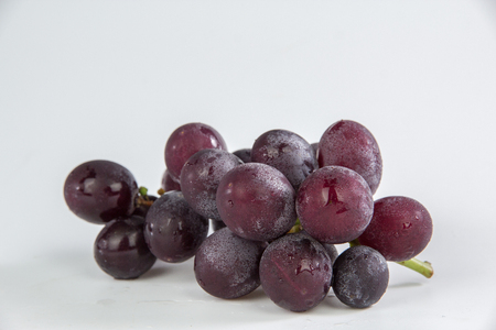 Grapes bunch isolated on white backgroundの写真素材