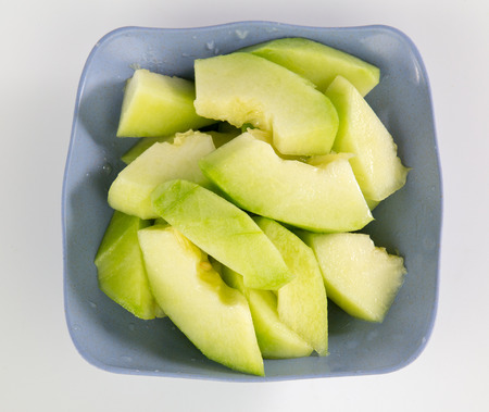 Cutting green cantaloupeの写真素材