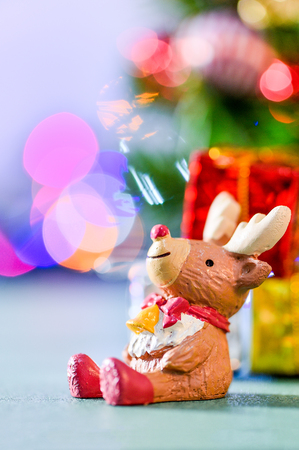reindeer decoration on colorful light spots backgroundの写真素材