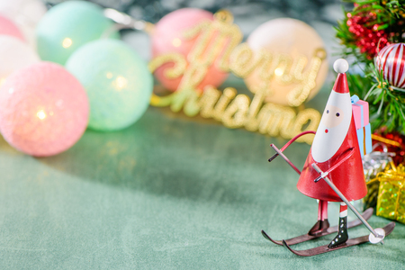 christmas decoration, skating santa claus with christmas english character and Christmas imagery isolated on green backgroundの写真素材
