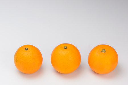 fresh oranges isolated on white backgroundの写真素材