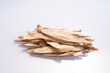 Chinese herbal medicines -- Astragalus on white background, blank for text copy space,の写真素材