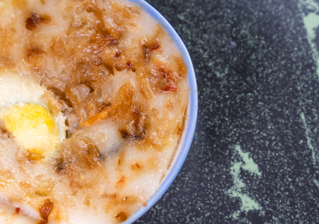 Taiwan's distinctive famous snacks: Savory rice pudding (Wa gui) in a white bowl on stone table, Taiwan Delicacies, Taiwan Street Foodの写真素材