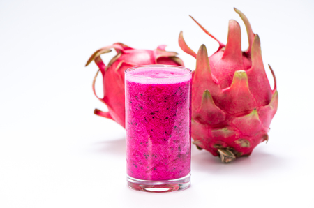 Fresh red dragon (pitaya) fruit juice in glass mug.の写真素材
