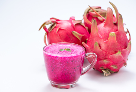 Fresh red dragon (pitaya) fruit juice in glass mug.の写真素材