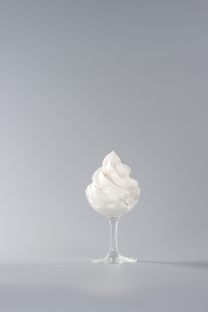 Soft serve ice cream isolated with colored background, copy space(text space), blank for text, vanilla flavoursの写真素材