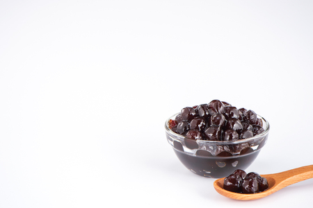 Black pearls. Boiled tapioca pearls for bubble tea on white background. Copy spaceの写真素材
