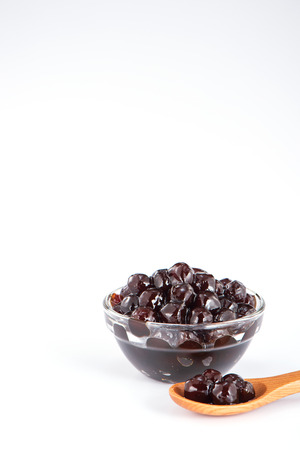 Black pearls. Boiled tapioca pearls for bubble tea on white background. Copy spaceの写真素材
