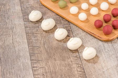 The cooking step of making Japanese Dango dessert with 3 different color in pink(red), white, and green, recipe, hanami Dango, tsukimi Dango, copy spaceの写真素材