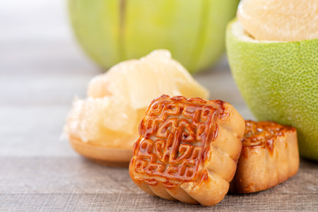 fresh and peeled pomelo(shaddock), grapefruit with slices and mooncake in mid-autumn festival(moon...