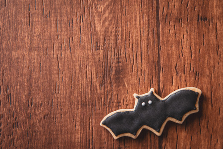 Fresh delicious homemade decorated halloween cookies sweets on dark wooden background, concept of halloween party, copy space(text space), top view, blank for text.の写真素材