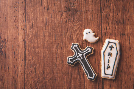 Fresh delicious homemade decorated halloween cookies sweets on dark wooden background, concept of halloween party, copy space(text space), top view, blank for text.の写真素材